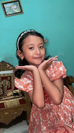 Indoor portraits and notebook writing at a Dhaka home