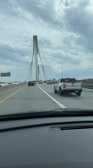 Evening traffic flows across cable-stayed bridge in Coquitlam
