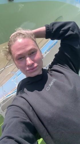 Woman takes selfie on boat in Dahab, Egypt