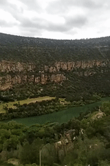 Tourist documents scenic views at Bin El Ouidane Dam, Morocco