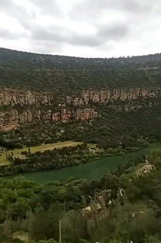 Tourist documents scenic views at Bin El Ouidane Dam, Morocco