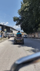 ATV rolling through a paved road in Bahang, India