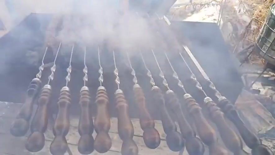 Outdoor barbecue session documented in Nizhnevartovsk, Russia