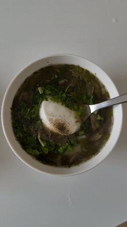 Garnished soup bowl photographed in Tel Aviv