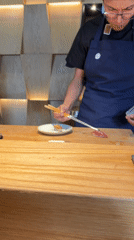 Sushi chef serves dinner in Mexico City restaurant
