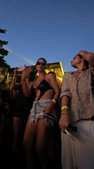 DJ performs seaside sunrise set with laser show in Brazil