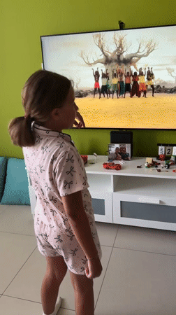 Lazy morning at home: dancing, a playful dog, and a parked bike