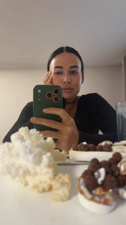 Woman photographed with green smartphone in Saint Petersburg