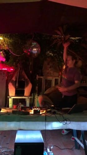 Outdoor DJ set running at a nighttime gathering in Da Lat