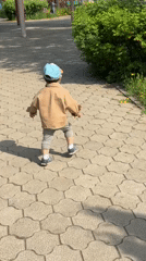 Toddler explores park with petting zoo in Chaikovsky, Russia