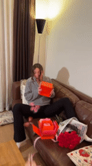 Woman receives gifts, flowers at Moscow apartment celebration