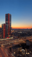Dusk view captures illuminated Khimki cityscape and highways