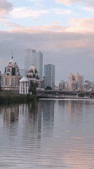 Duck family on Astana waterway at golden hour
