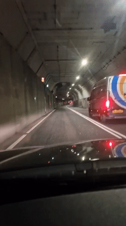 Vehicle travels through dimly lit tunnel in North Tyneside