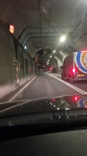 Vehicle travels through dimly lit tunnel in North Tyneside