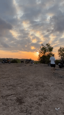 Sunset hilltop hangout with scooters near GWK, Bali