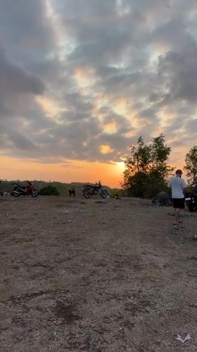 Sunset hilltop hangout with scooters near GWK, Bali