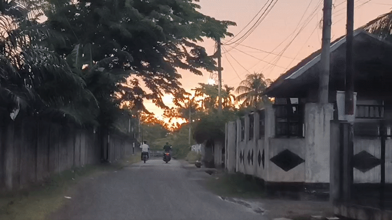Sunset captured from two Indonesian villages during evening rain