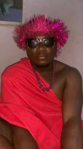 Person in pink headdress photographed in Akwanga, Nigeria