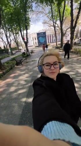 Woman documents casual stroll around Odesa Opera House area