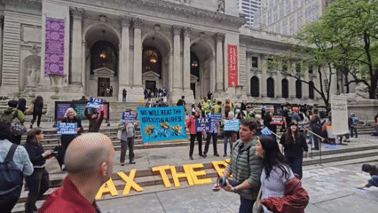 Wealth tax protesters gather at NYC building steps