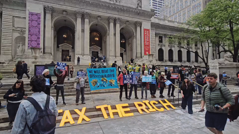 Wealth tax protesters gather at NYC building steps
