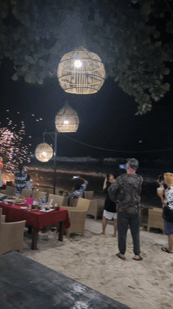 Fire performers entertain crowds at Thailand beach restaurant