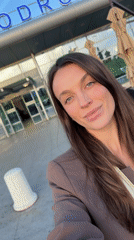 Traveler Takes Selfies Outside Podgorica Airport with Boarding Passes