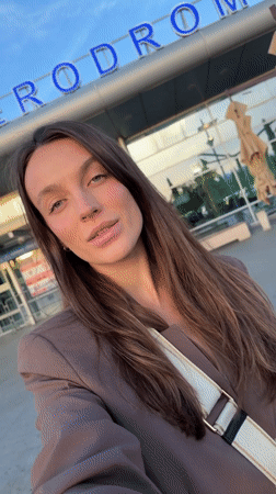Traveler Takes Selfies Outside Podgorica Airport with Boarding Passes
