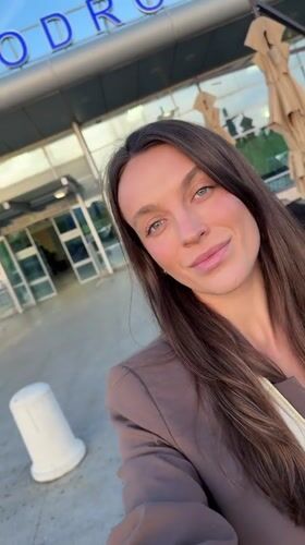 Traveler Takes Selfies Outside Podgorica Airport with Boarding Passes