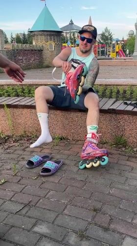 Suiting up for a rollerblade session in a Krasnoyarsk park