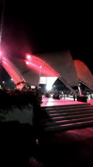 Live music and dancing at an outdoor night event in Indonesia