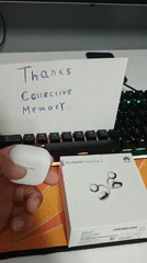 Person unboxes new Huawei wireless earbuds at desk