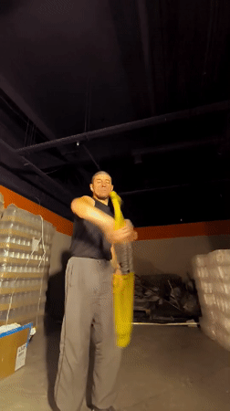 Flow arts practice in a Qarağandı warehouse, July 2026