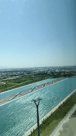 Uzbekistan resort complex with waterways, patios, and fresh flowers