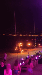 Nighttime pool party with blue lights in บ้านบางรักษ์, Thailand