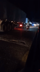 Nighttime traffic observed on dark road in Lokoja, Nigeria