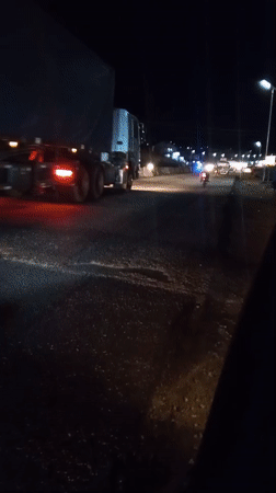 Nighttime traffic observed on dark road in Lokoja, Nigeria