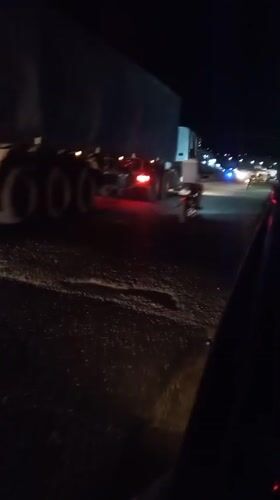Nighttime traffic observed on dark road in Lokoja, Nigeria