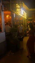Fire performers entertain patrons at Thai beachside bar