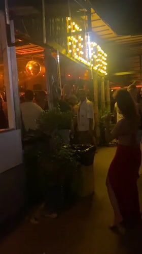 Fire performers entertain patrons at Thai beachside bar