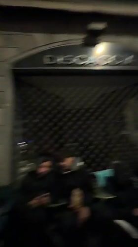 Nighttime gathering outside building in Bergamo, Italy