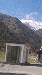 Snow-capped mountains and green landscape captured in Tajikistan