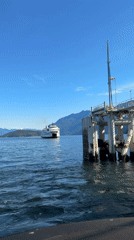 Ferry crosses West Vancouver waters under partly cloudy skies