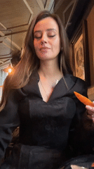 Woman takes shot with orange chaser at Moscow restaurant