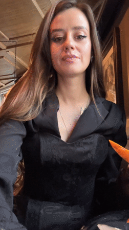 Woman takes shot with orange chaser at Moscow restaurant