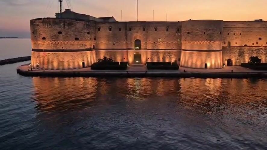 Taranto at dusk: castle, harbor, and Mediterranean Games 2026