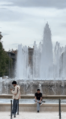 Young men gather near fountain in Milan park