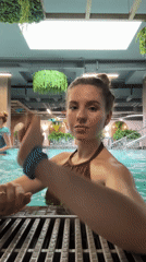 Woman enjoys spa day with fish pedicure, pool time