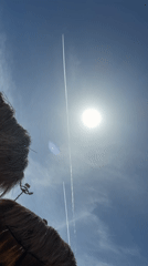 Clear skies and contrails mark beach day in Hurghada